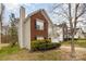 View of a two-story home showcasing brick accents, neat landscaping, and a private driveway in a tranquil neighborhood at 10228 Seedling Ln, Charlotte, NC 28214