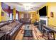 Inviting living room with leather sofas, a fireplace, and a large flat-screen TV, perfect for relaxation at 10228 Seedling Ln, Charlotte, NC 28214