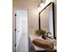 Bathroom with a large mirror and open doorway to a hallway at 1057 Farm Pond Ln, Rock Hill, SC 29732