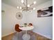 Modern dining area with stylish lighting, a round table, and two chairs, ideal for intimate meals at 1057 Farm Pond Ln, Rock Hill, SC 29732