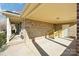 Covered carport area featuring brick walls, wood supports and access to backyard, providing convenience and style at 108 Colonial Dr, Kings Mountain, NC 28086