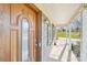 Inviting front entrance with elegant wood door, brick facade, and a welcoming porch at 108 Colonial Dr, Kings Mountain, NC 28086