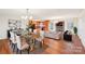 Elegant living space with modern dining set, sleek furnishings, and a cozy fireplace at 108 Colonial Dr, Kings Mountain, NC 28086