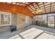 Enclosed brick patio with ceiling fan, outdoor ceiling and windows at 108 Colonial Dr, Kings Mountain, NC 28086