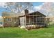 Enjoy the outdoors in this screened-in porch, perfect for entertaining and relaxation at 108 Colonial Dr, Kings Mountain, NC 28086