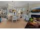 Cozy dining area with a fireplace, comfortable seating, and elegant decor, ideal for gatherings at 1158 South S St, Cornelius, NC 28031