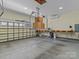 Spacious garage featuring ample storage, work area, and convenient lift system for organization and maximizing space at 1158 South S St, Cornelius, NC 28031