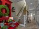 Hallway with the view of stairs and a red cabinet, creating an elegant transition space at 1158 South S St, Cornelius, NC 28031