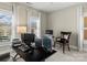 Functional home office featuring a large desk with multiple monitors, a comfortable chair, and ample natural light at 1158 South S St, Cornelius, NC 28031