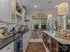 Bright kitchen with white cabinets, stylish fixtures, and ample counter space for cooking at 1158 South S St, Cornelius, NC 28031