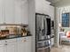 Close-up of a stylish kitchen featuring modern stainless steel appliances and sleek cabinetry at 1158 South S St, Cornelius, NC 28031