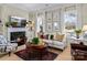 Inviting living room features a fireplace, comfortable seating, and bright natural light at 1158 South S St, Cornelius, NC 28031
