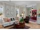 Bright living room featuring stylish seating, elegant decor, and seamless flow to other rooms at 1158 South S St, Cornelius, NC 28031