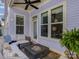 Cozy covered patio with comfortable seating, a fire pit, and plenty of natural light at 1158 South S St, Cornelius, NC 28031