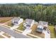 New construction homes feature modern design elements and well-maintained landscaping in a suburban setting with mature trees at 1195 Cavalier Ln, Rock Hill, SC 29730
