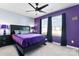 Bedroom featuring a black bed frame, black curtains, and dark purple accent wall at 1195 Cavalier Ln, Rock Hill, SC 29730
