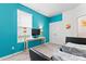 Bright bedroom features turquoise paint, TV, and carpeted floor at 1195 Cavalier Ln, Rock Hill, SC 29730