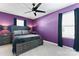 Bedroom with purple accent wall with a ceiling fan and grey furniture at 1195 Cavalier Ln, Rock Hill, SC 29730