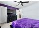 This bedroom features a black dresser, ceiling fan, and purple accent wall at 1195 Cavalier Ln, Rock Hill, SC 29730
