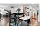 Open-concept dining area features stylish furniture and a view of the staircase and living room at 1195 Cavalier Ln, Rock Hill, SC 29730