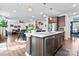Open kitchen design with stainless steel appliances, a center island, and a view into the living room at 1195 Cavalier Ln, Rock Hill, SC 29730