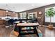 Open-concept kitchen flows into the dining space with a black table and stylish chairs, filled with natural light at 1195 Cavalier Ln, Rock Hill, SC 29730