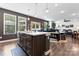 Kitchen island with sleek countertops and dark wood cabinets, seamlessly connecting to the dining area at 1195 Cavalier Ln, Rock Hill, SC 29730