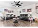 Spacious living room features hardwood floors, ceiling fan, and comfortable black leather seating at 1195 Cavalier Ln, Rock Hill, SC 29730