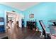 Stylish office with hardwood floors, turquoise paint, and a view to the entry hall at 1195 Cavalier Ln, Rock Hill, SC 29730