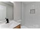Refinished bathroom with shower, modern tile, and updated vanity at 1356 Ford Dr, Lowell, NC 28098