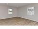 Bright bedroom with windows, refinished floors, and ample natural light at 1356 Ford Dr, Lowell, NC 28098