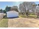 Detached garage with a large driveway for extra parking at 1356 Ford Dr, Lowell, NC 28098
