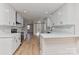 Bright open kitchen with white cabinets, stainless steel appliances, and modern design, great for entertaining at 1356 Ford Dr, Lowell, NC 28098
