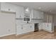 Beautiful white kitchen boasts modern cabinets, stainless steel appliances, and stylish backsplash at 1356 Ford Dr, Lowell, NC 28098