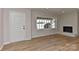 Inviting living room featuring a fireplace, new windows, and stylish laminate flooring at 1356 Ford Dr, Lowell, NC 28098