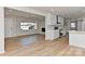 Open-concept living space with updated kitchen, hardwood floors, fireplace, and modern finishes at 1356 Ford Dr, Lowell, NC 28098