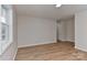 Neutral room featuring new laminate flooring and large window at 1356 Ford Dr, Lowell, NC 28098
