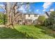 The property features a well-maintained lawn, established trees, and a private outdoor area at 1626 Beverly Dr, Charlotte, NC 28207