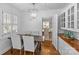 Dining area with elegant chairs, views to dining room, and custom cabinets at 1626 Beverly Dr, Charlotte, NC 28207