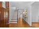 Bright foyer with hardwood floors, a staircase, and a decorative console table at 1626 Beverly Dr, Charlotte, NC 28207