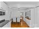 Kitchen area with eat-in dining, stainless appliances, white cabinets, and granite countertops at 1626 Beverly Dr, Charlotte, NC 28207