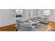 Cozy living room featuring neutral furnishings, hardwood floors, and plenty of natural light at 1626 Beverly Dr, Charlotte, NC 28207