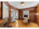 Inviting living room featuring hardwood floors, wood trim and natural light at 1626 Beverly Dr, Charlotte, NC 28207