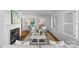 Bright living room featuring a fireplace, hardwood floors, and views into the dining area at 1626 Beverly Dr, Charlotte, NC 28207