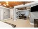 Spacious bedroom featuring a wood-paneled ceiling, neutral tones, and a dedicated office area at 2007 Fernhurst Ter, Matthews, NC 28104