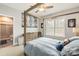 Inviting bedroom with four poster bed, an adjacent shower and a view to the outdoors at 2007 Fernhurst Ter, Matthews, NC 28104