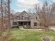 Charming brick home featuring a well-manicured lawn, covered front porch, and beautiful architectural details at 2007 Fernhurst Ter, Matthews, NC 28104