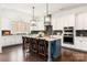 Bright kitchen with marble countertops, black backsplash, and a large island with seating at 2007 Fernhurst Ter, Matthews, NC 28104