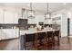 Spacious kitchen with a large island, barstool seating, and modern stainless steel appliances at 2007 Fernhurst Ter, Matthews, NC 28104