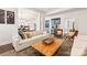Inviting living room with a large couch, wooden coffee table, and stylish decor at 2007 Fernhurst Ter, Matthews, NC 28104